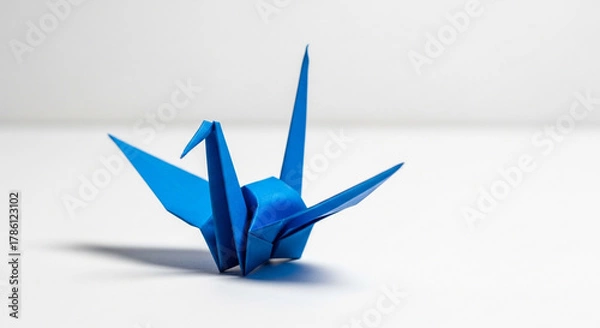 Obraz Origami crane isolated on white background, a symbol of peace and hope