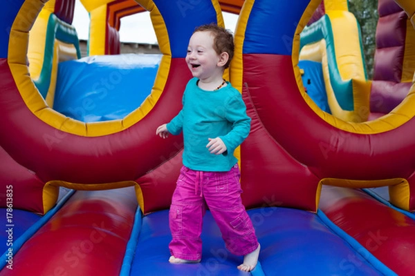 Obraz Funny toddler run on trampoline