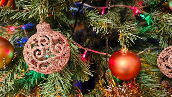 Obraz Christmas tree branches with beautiful balls and lights