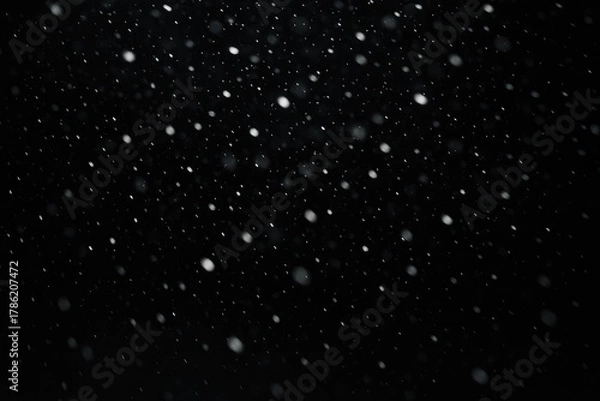 Obraz Falling snow particles in a dark winter night, atmospheric snowfall effect, winter precipitation