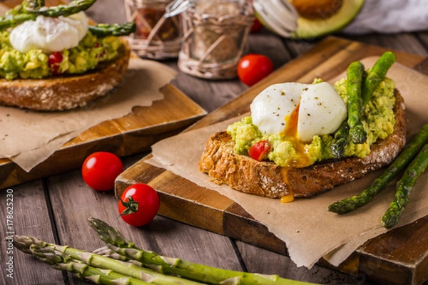 Fototapeta poached eggs on multiseed bread landscape