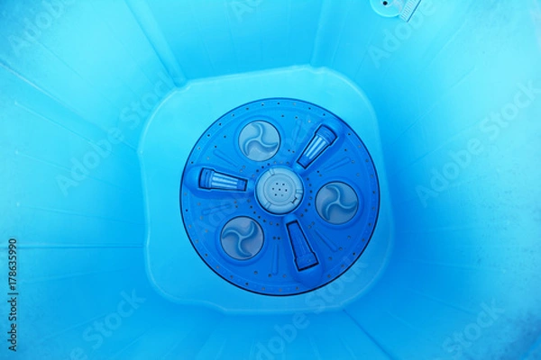 Obraz the inside of blue wasing machine plastic tank