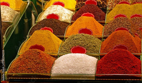 Fototapeta Colorful piles of Turkish spices sold outside in Istanbul bazaar