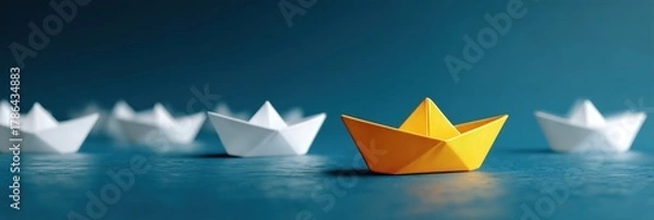 Fototapeta Boat paper concept yellow ship business leadership leader lead origami partnership. Background boat paper concept change journey success crew blue compass unique different fleet join team challenge