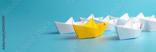 Fototapeta Boat paper concept yellow ship business leadership leader lead origami partnership. Background boat paper concept change journey success crew blue compass unique different fleet join team challenge