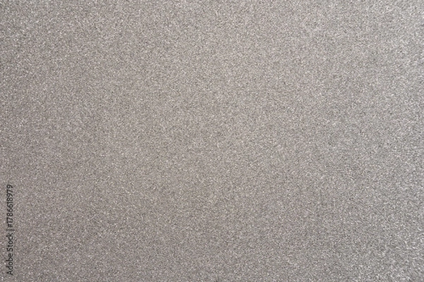 Fototapeta Shimmering silver surface with a smooth texture used for creative projects and design work