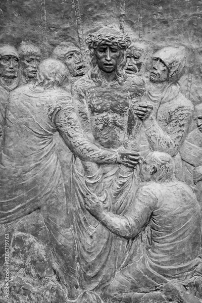 Obraz Station X: Jesus is stripped of his garments (Division of robes). The Way of the Cross on Mount Križevac (the Cross Mountain) in Medjugorje.