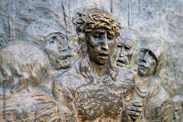 Obraz Station X: Jesus is stripped of his garments (Division of robes). The Way of the Cross on Mount Križevac (the Cross Mountain) in Medjugorje.