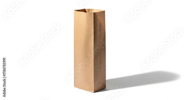 Obraz A tall, brown kraft paper shopping bag for carrying a bottle or long groceries, standing upright and isolated on a white background