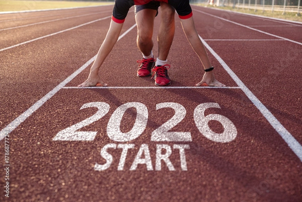 Fototapeta Young man ready to run preparing for 2026 goals.