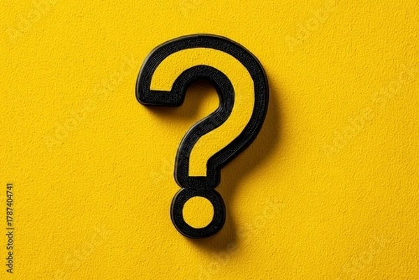 Fototapeta A visually striking three-dimensional question mark symbol, rendered in a bold yellow fill with a contrasting textured black outline, stands against a vibrant, bright yellow background with a subtle g