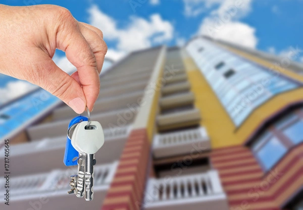 Fototapeta Hand holds the keys to a new apartment