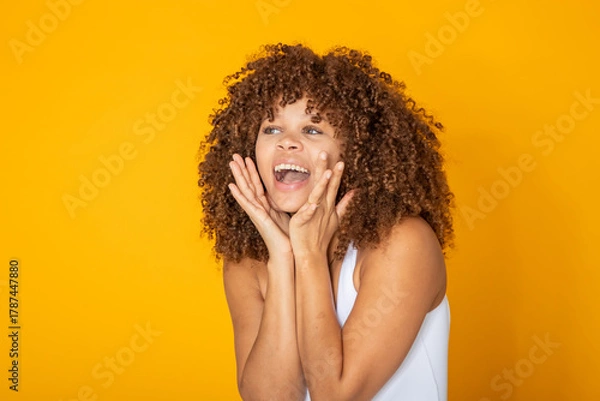 Obraz young woman screaming in amazement isolated on background