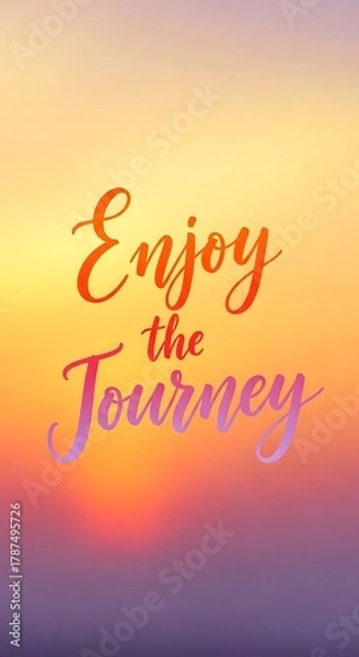Fototapeta Inspirational quote on a colorful sunset background encouraging viewers to enjoy the journey in life