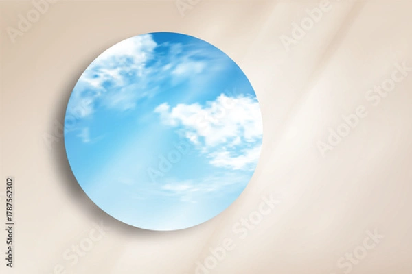 Obraz Minimal round mirror reflecting bright blue sky and clouds on beige wall background. Clean and modern composition ideal for product mockup, cosmetic display, branding, and design presentation.