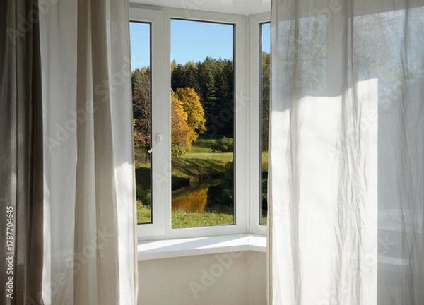 Fototapeta  View from the window  on yellow treesin a garden, landscape with autumn forest, window frame.