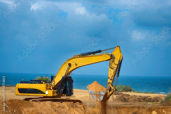 Obraz Earthmover is preparing to load a truck