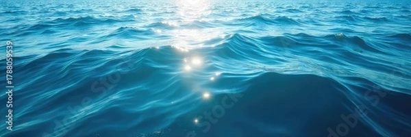 Fototapeta Vast expanse of deep blue ocean water, sunlit surface with gentle waves, tranquil seascape, perfect for travel or nature themes ,  tranquil,  coastal