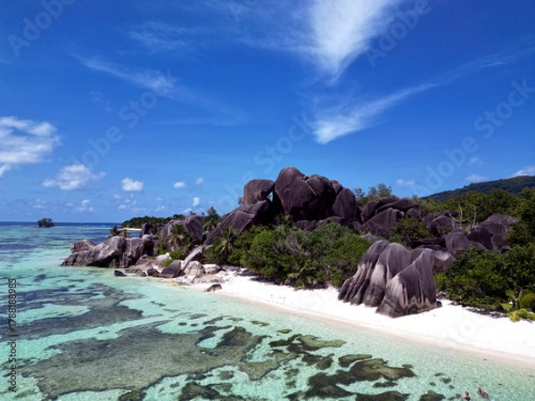 Fototapeta Anse Cocs beach, La Digue Seychelles, tropical beach during a luxury vacation in Seychelles. Tropical beach Anse Cocs beach, La Digue, Praslin, Mahe Seychelles with turqouse colored ocean