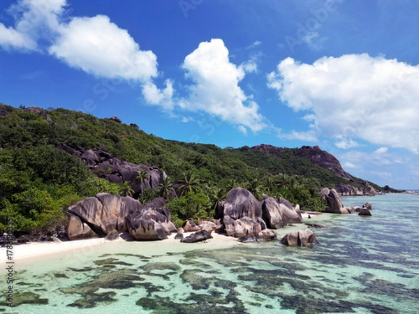 Fototapeta Anse Cocs beach, La Digue Seychelles, tropical beach during a luxury vacation in Seychelles. Tropical beach Anse Cocs beach, La Digue, Praslin, Mahe Seychelles with turqouse colored ocean