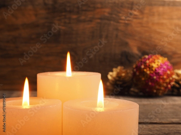 Fototapeta Third Advent candles burning with Christmas decoration on a wooden background