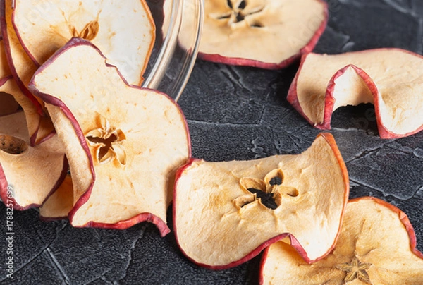 Fototapeta large round dried apple chips in a jar