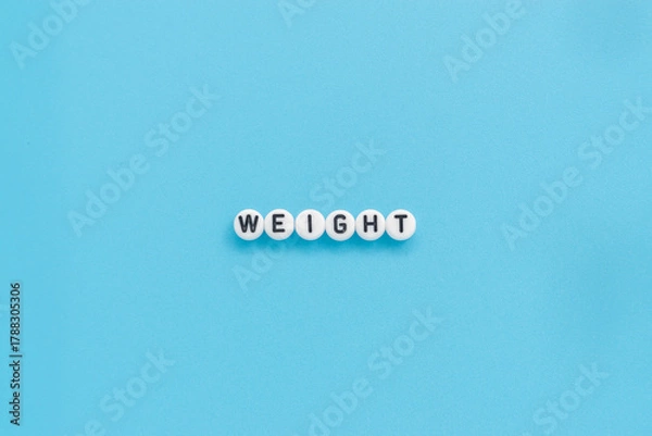 Obraz Weight text on light blue background