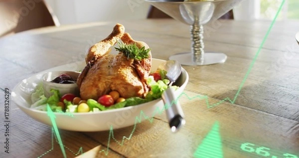 Fototapeta Serving roasted whole chicken in white bowl on dining table, with lettuce, tomatoes, green overlay