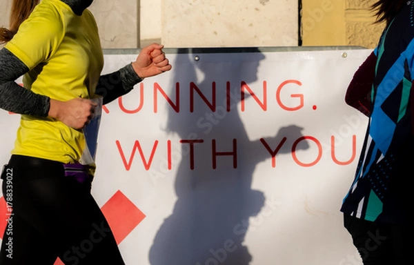 Obraz Suportive message for runners participating in a marathon event outdoors in Ljubljana. Running with you