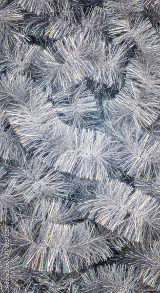 Fototapeta Shiny silver tinsel forming a sparkling christmas background texture perfect for holiday party invitations and festive decorations, decoration, abstract, wintertime