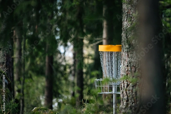 Fototapeta yellow disgolf target in the woods