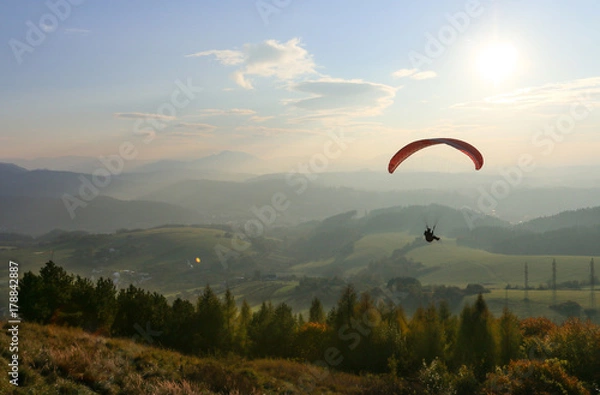 Obraz Paragliding in sunset