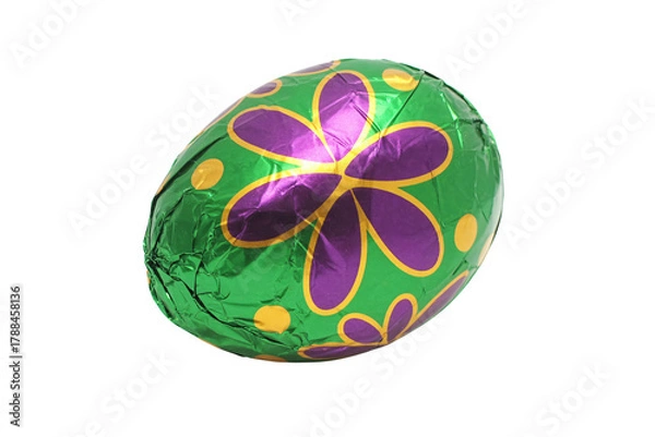 Fototapeta Celebrate Easter with a vibrant green chocolate egg wrapped in colorful foil, perfect for gifting and festive holiday celebrations with family and friends