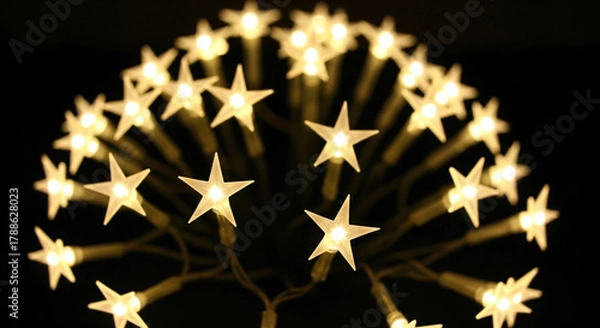 Fototapeta A charming and festive array of twinkling star-shaped lights, creating a bright, magical atmosphere with a delicate, airy glow that softly illuminates the dark