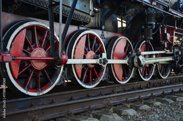 Fototapeta steam locomotive wheels on rails close-up