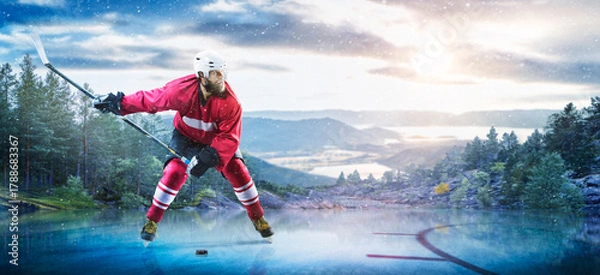 Obraz Hockey players in action on the ice. Outdoor game. Sports. Hockey match. A large hockey rink in the middle of an forest. Hockey concept. Panorama