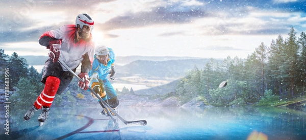 Obraz Hockey players in action on the ice. Outdoor game. Sports. Hockey match. A large hockey rink in the middle of an forest. Hockey concept. Panorama