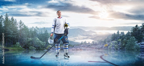 Obraz Hockey players in action on the ice. Outdoor game. Sports. Hockey match. A large hockey rink in the middle of an forest. Hockey concept. Panorama