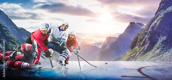 Obraz Hockey players in action on the ice. Outdoor game. Sports. Hockey match. A large hockey rink in the middle of an forest. Hockey concept. Panorama