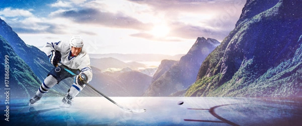 Obraz Hockey players in action on the ice. Outdoor game. Sports. Hockey match. A large hockey rink in the middle of an forest. Hockey concept. Panorama