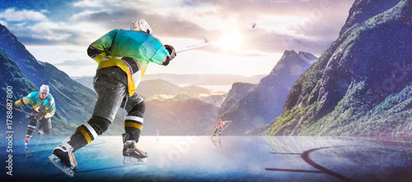 Obraz Hockey players in action on the ice. Outdoor game. Sports. Hockey match. A large hockey rink in the middle of an forest. Hockey concept. Panorama