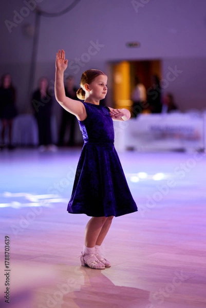 Fototapeta Children compete in ballroom dancing event with grace