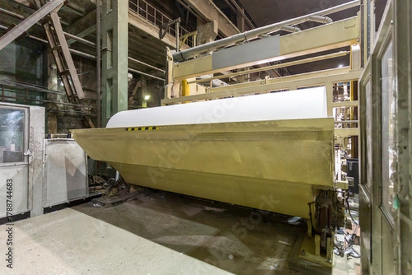 Fototapeta Jumbo rolls in a paper factory workshop.