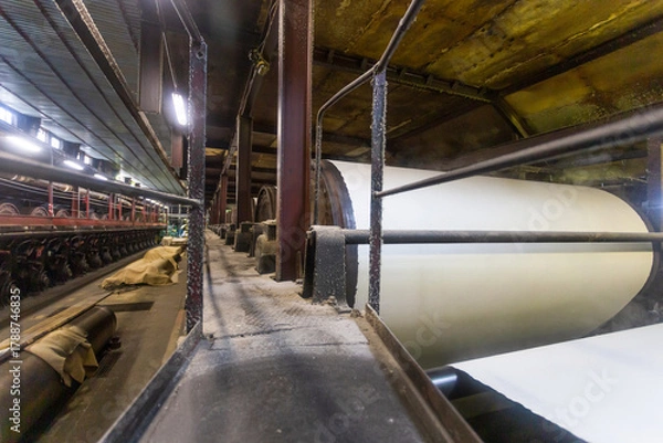 Fototapeta Jumbo rolls in a paper factory workshop.