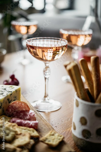 Fototapeta Glasses of rose wine seen during a dinner party of a celebration.