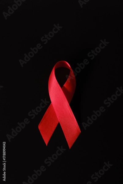 Fototapeta red ribbon symbol of World AIDS Day. Top view. Free copy space.