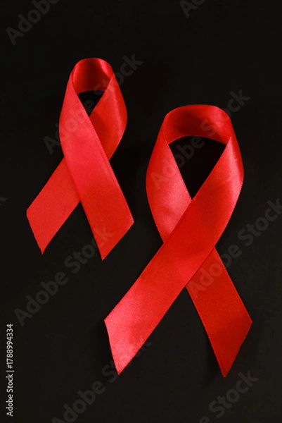 Fototapeta red ribbon symbol of World AIDS Day. Top view. Free copy space.