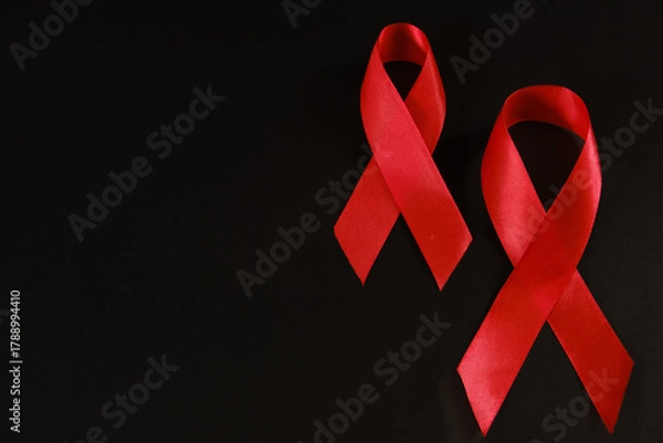 Fototapeta red ribbon symbol of World AIDS Day. Top view. Free copy space.