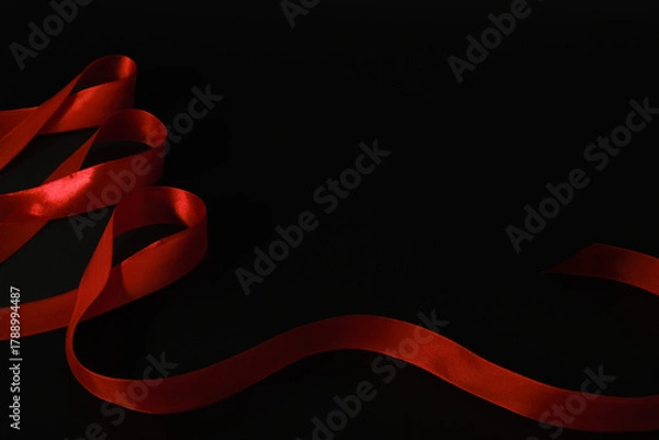 Fototapeta red ribbon symbol of World AIDS Day. Top view. Free copy space.