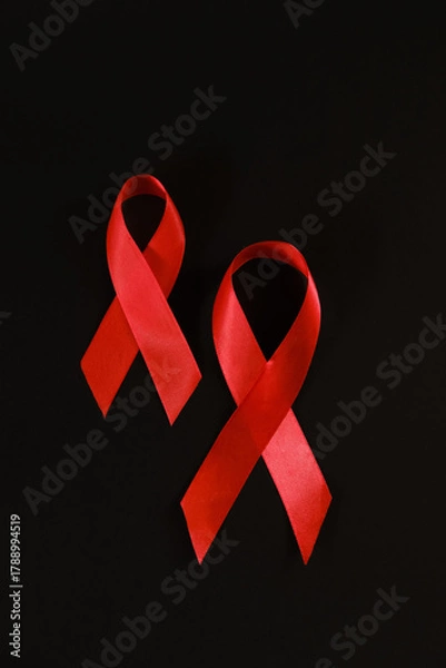 Fototapeta red ribbon symbol of World AIDS Day. Top view. Free copy space.